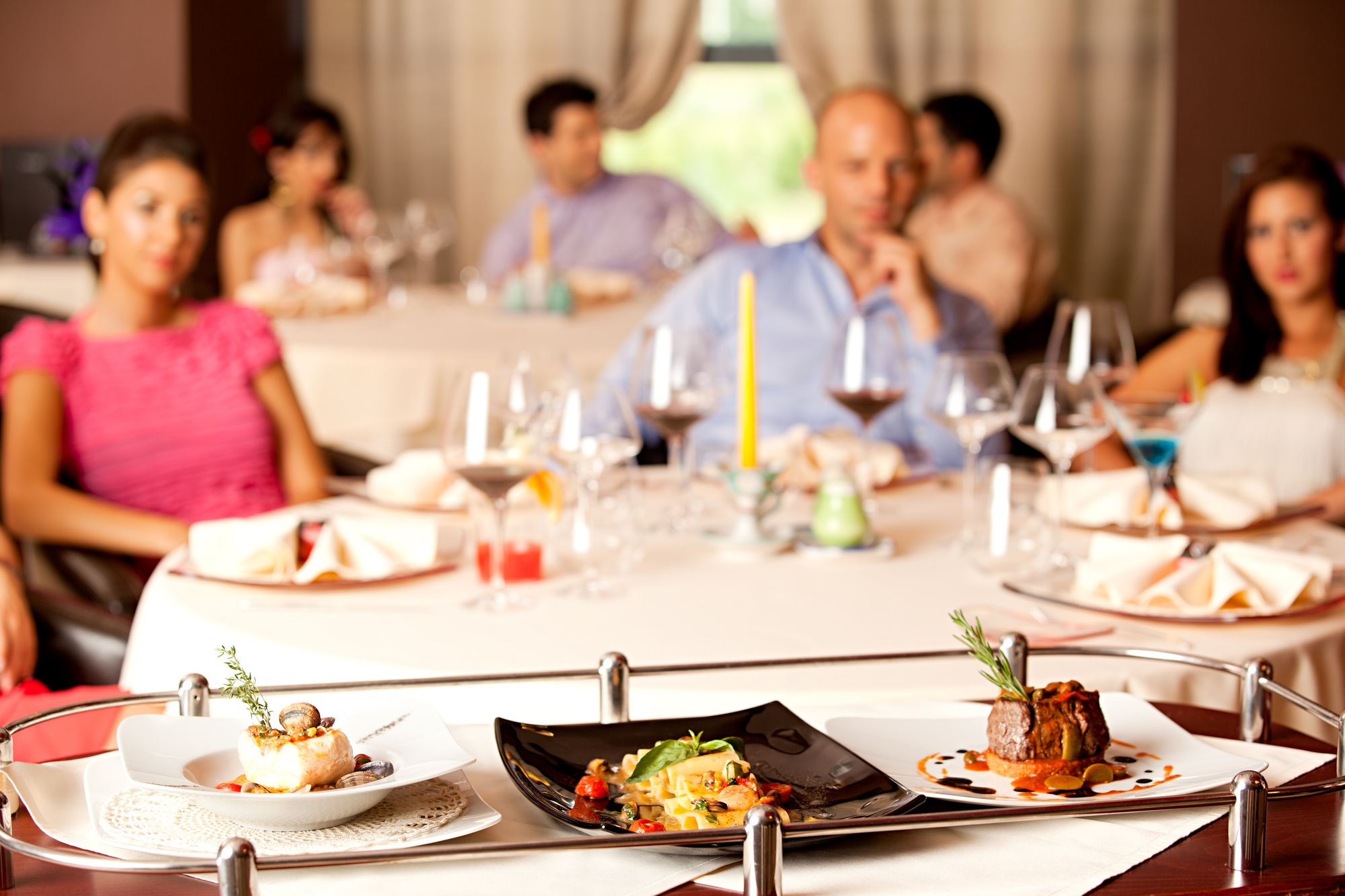 people having meal served in restaurant