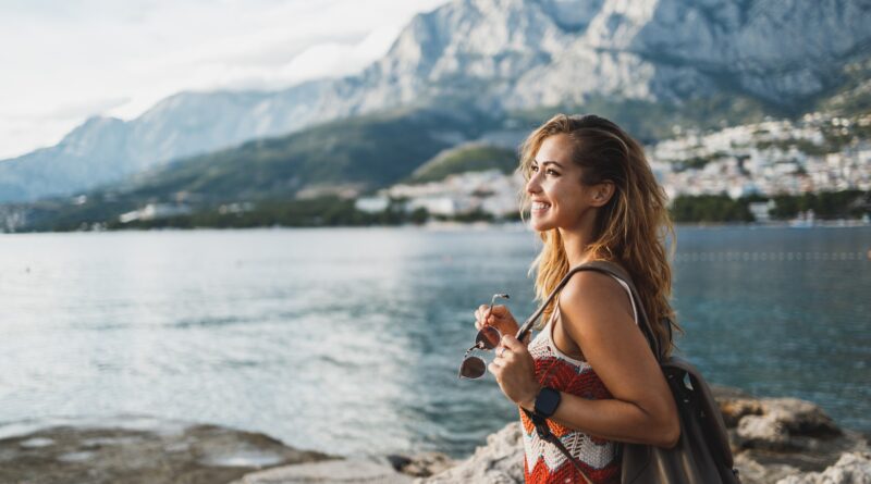 Woman Enjoying A Summer Vacation While Exploring Mediterranean Coast